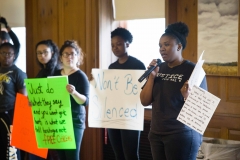 Senior Paris Murray reads a letter from a student of color  to President McCoy. Students of color silently protested at a  family weekend event on Saturday morning. SAM CARAVANA /THE DEPAUW