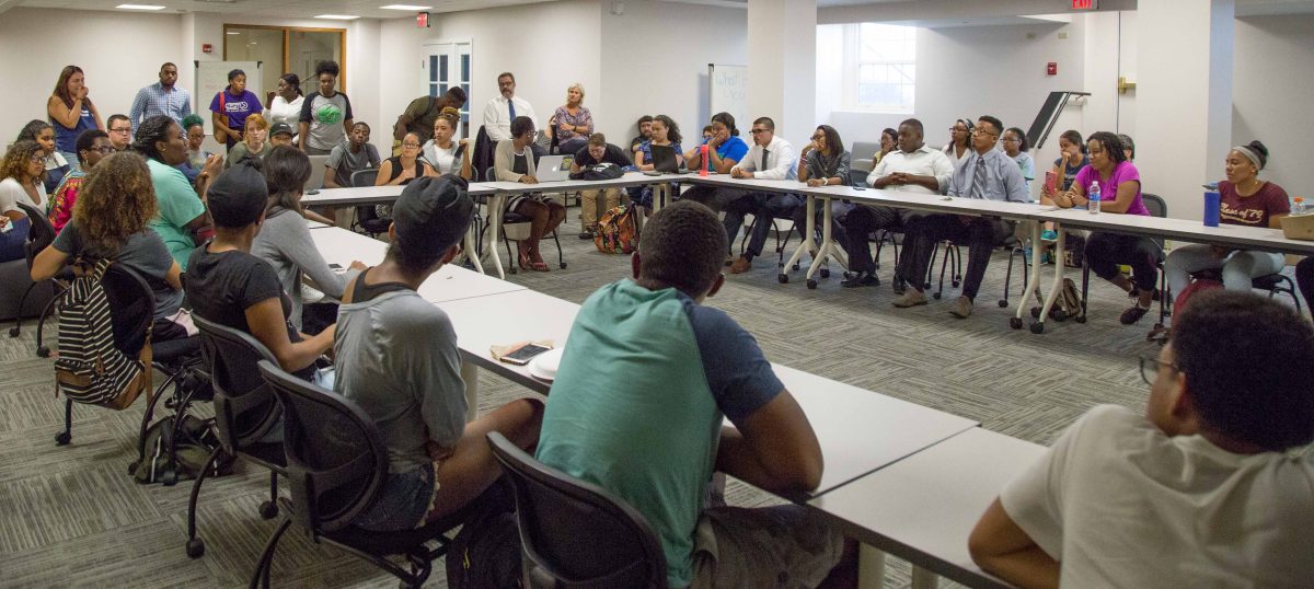 Students and faculty of color meet Tueday night after the Association of African American Students called an emergency meeting. The meeting was called after a racial slur was written on a white board on the door of a student of colors dorm room. SAM CARAVANA / THE DEPAUW