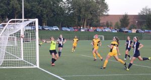 Franklin goalie, Jess Young, tries to stop shot made by DePauw Tiger Ali Grimm. DAVID KOBE/ THE DEPAUW