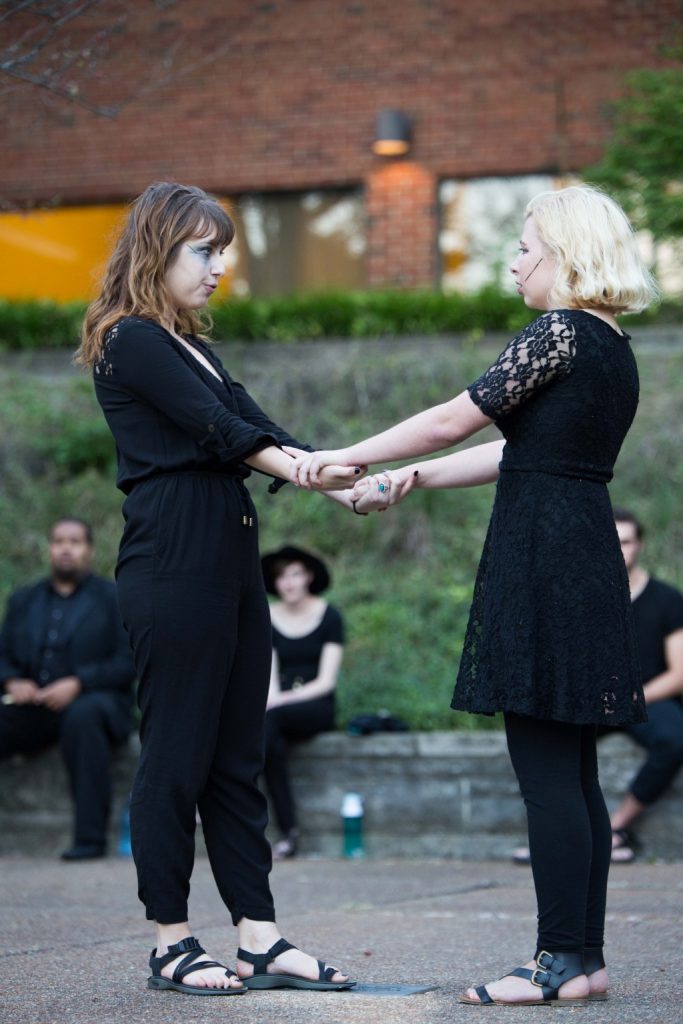 Hannah Joy Gauthier (left) plays Julietwhile Maggie Furtner (right) plays Romeo. The Duzer Du chapter of Alpha Psi Omega performed Romeo and Juliet outdoors in the Theta Gardens on Friday.  SAM CARAVANA / THE DEPAUW
