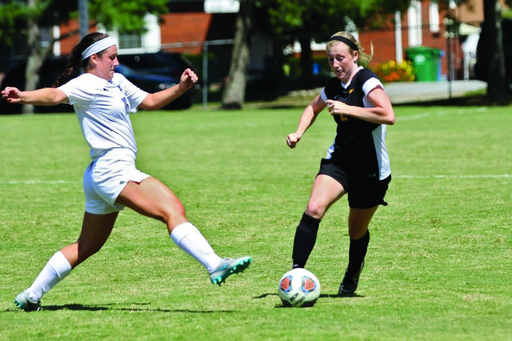 Sophomore midfielder Merrit Pogue dribbles past a defender in the Tigers 4-0 victoRy over John Carrol University Sunday. The Tigers have amassed a 2-0 record heading into their next away match Wednesday night. PHOTO COURTESY OF DAN SEEWER.