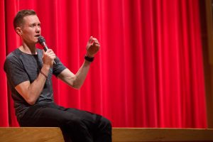 Trangender triathalete, Chris Mosier, speaks to a group of student-athletes on Sunday night. Mosier is the first known out trans athlete to make a  U.S. national team different from his gender assigned at birth. SAM CARAVANA / THE DEPAUW