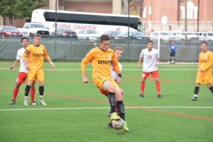 Senior Forward, Jonathan Wheeler, fights off Wabash player. The Tigers lose to Wabash for the first time in 17 years. PHOTO COURTESY OF DEPAUW UNIVERSITY