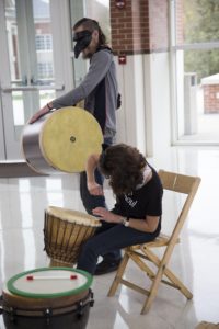 Faculty joins the drum circle to entertain the children around. GERALD PINEDA / THE DEPAUW