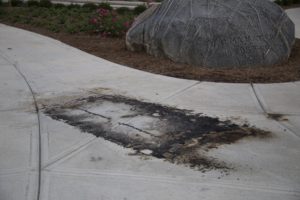 A burnt mark is left on the sidewalk after this weekend outside of East College, next to the boulder. GERALD PINEDA / THE DEPAUW