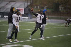 Senior quarterback Matt Hunt and Freshman quarterback Hank Neal practice their throwing before the upcoming Monon Bell Game this Saturday.