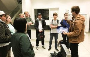 This is the first semester that the Film Studies program has offered classes on film production. Matthew Herbertz, far right, demonstrates to his students the variety of filters and lighting available for use. PHOTO COURTESY OF DEPAUW UNIVERSITY
