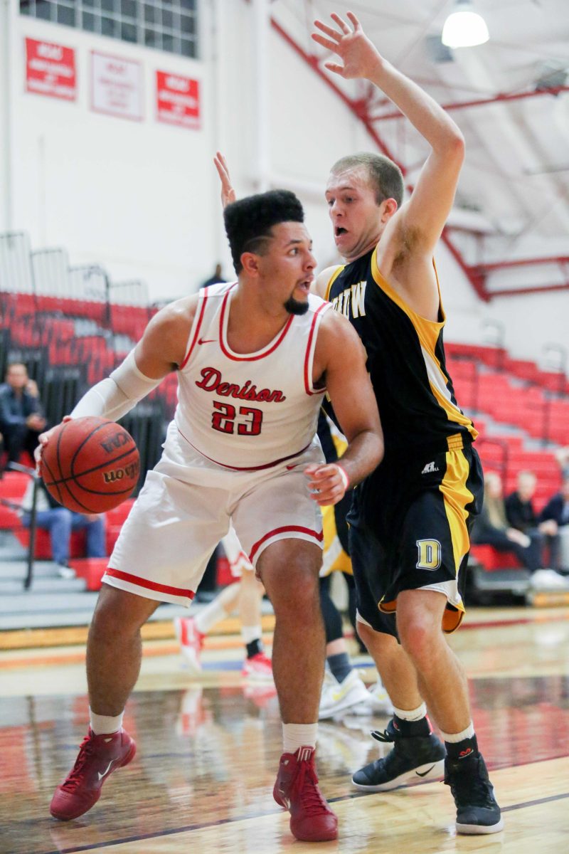 Junior David Voegel (right) defends Devon Pitts (left) along the baseline. The Tiger’s fell to the no. 19 ranked Big Red 74-61 on Thursday night. SAM CARAVANA / THE DEPAUW