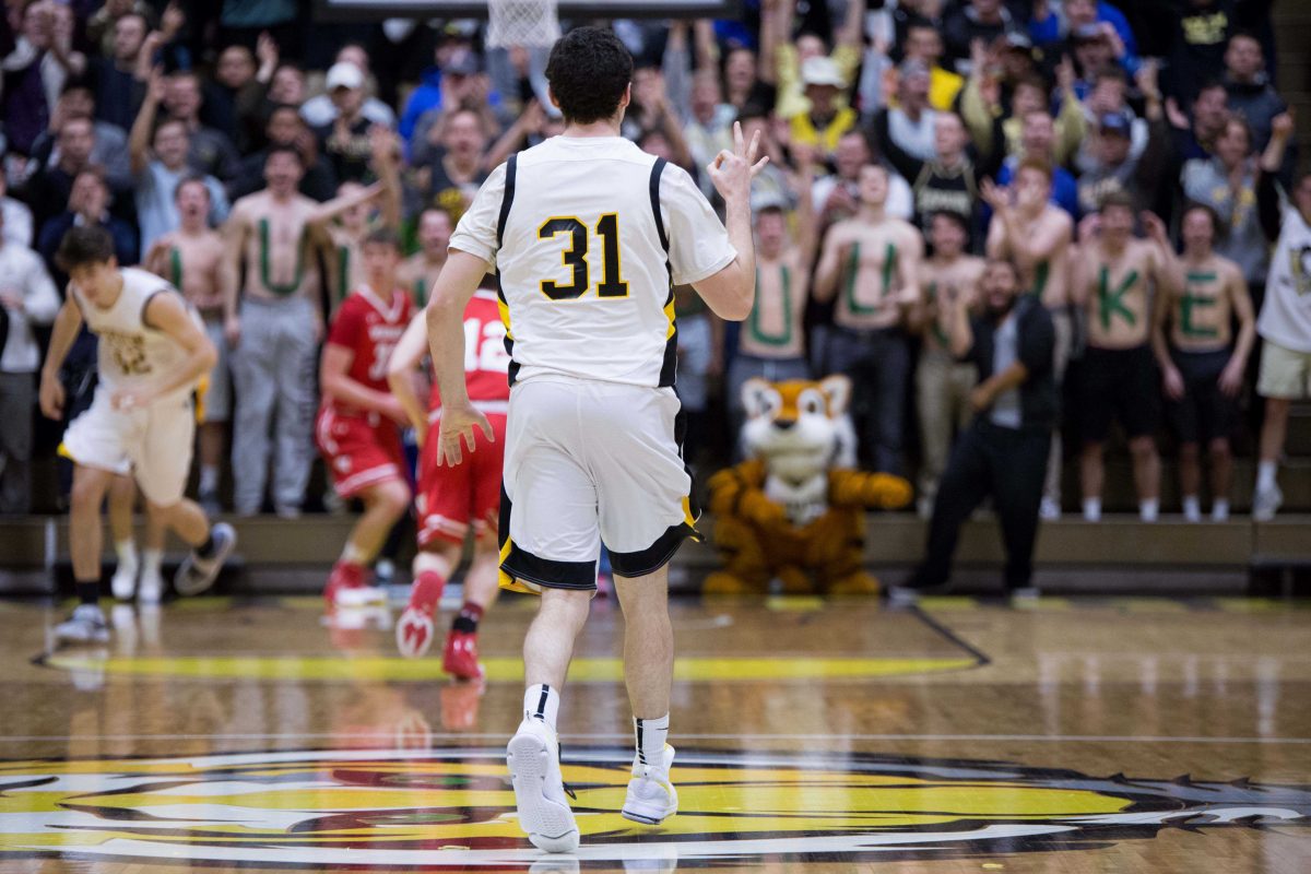 Senior Luke Lattner celebrates scoring a three-pointer. DePauw topped Wabash 70-50 in the final home game of the season. SAM CARAVANA / THE DEPAUW