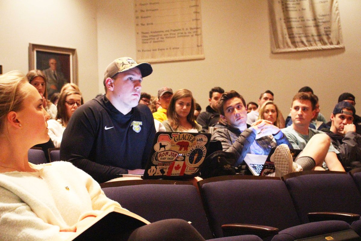 Former Phi Kappa Si President and Senior, Kole Brinegar, reads a list of concerns to President McCoy. DAVID KOBE / THE DEPAUW