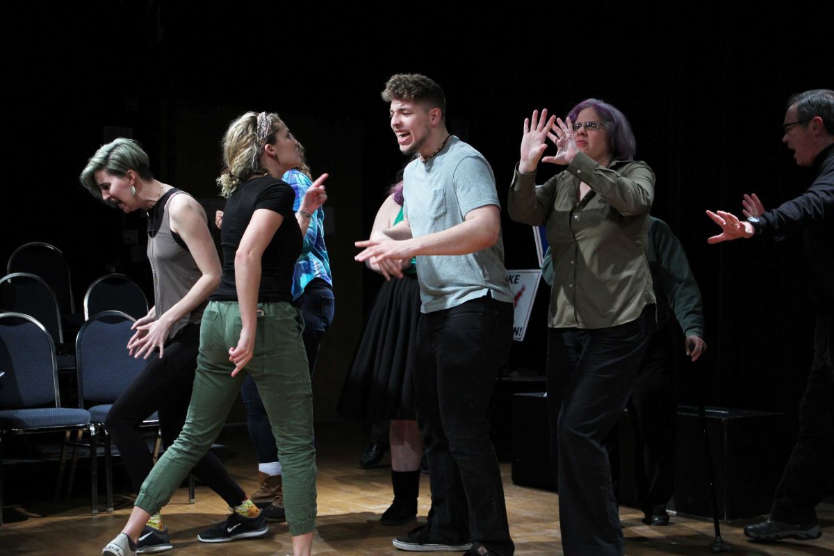 The cast of “Street Scenes” expresses anger as they perform a short scene of the play. NATALIA COSTARD / THE DEPAUW