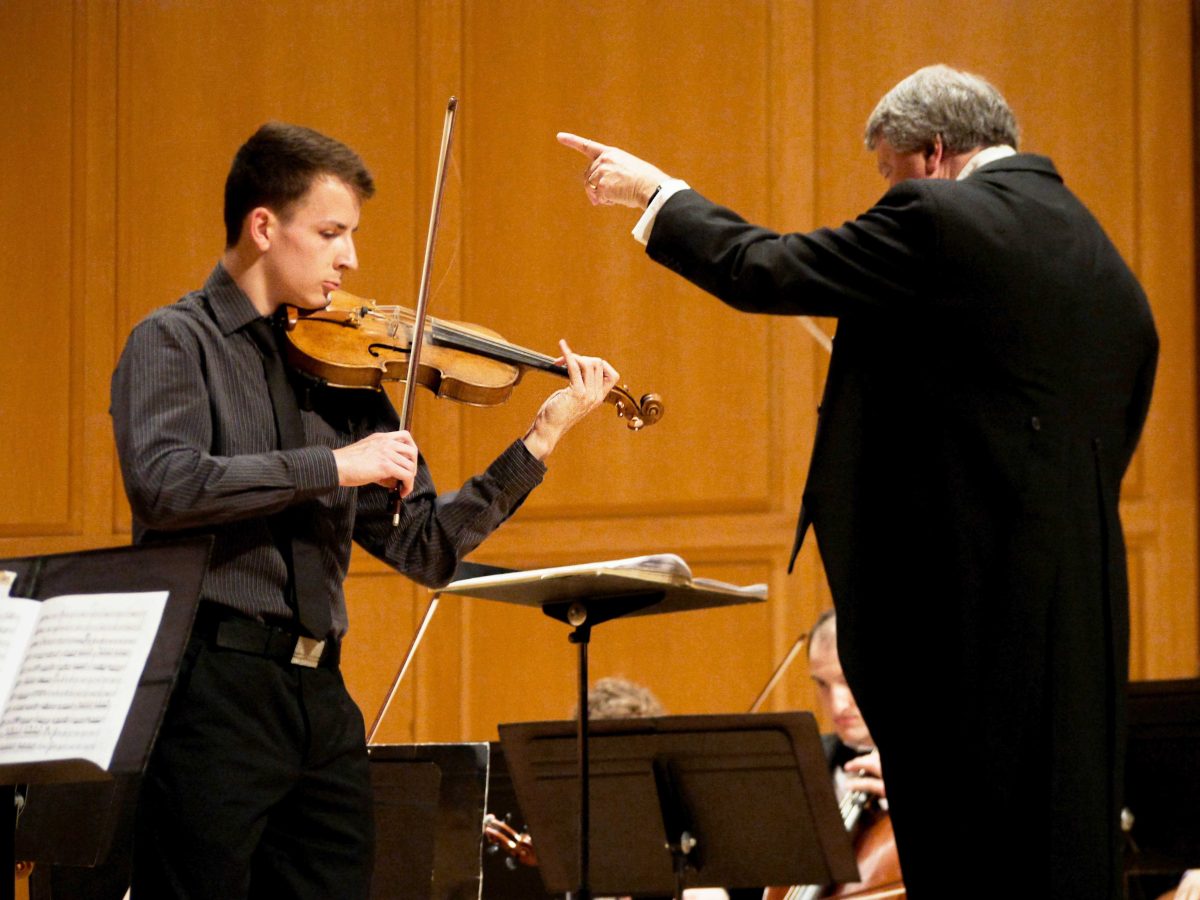 Junior violin soloist Jackson Bailey and Music Director Orcenith Smith. JESSICA MILLER / THE DEPAUW