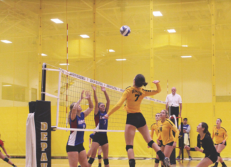 Sophomore, Suzanne Peters, attacks the ball to help the Tiger's win their set. DAVID KOBE / THE DEPAUW