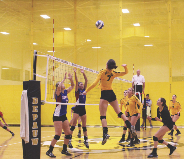 Sophomore, Suzanne Peters, attacks the ball to help the Tiger's win their set. DAVID KOBE / THE DEPAUW