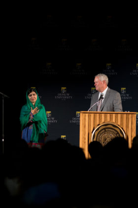 Malala waits to speak as crowd cheers