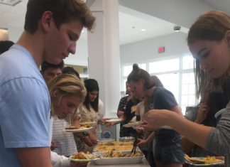 Students enjoy Indian food during the Eid celebration Remsha Khan