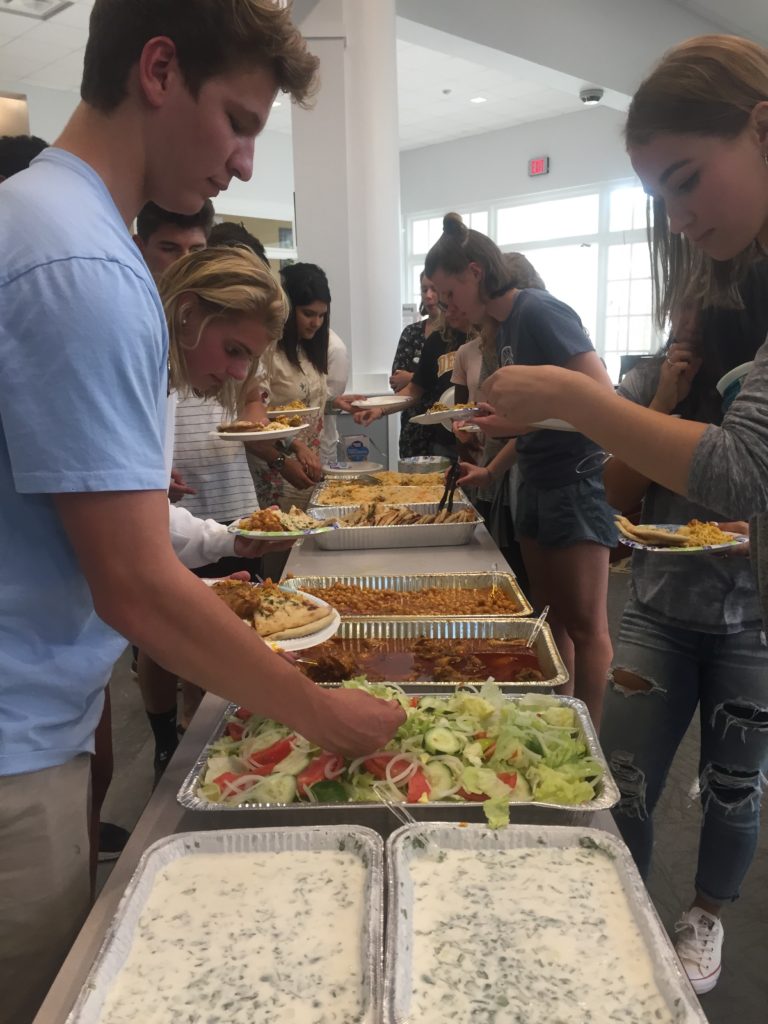 Students enjoy Indian food during the Eid celebration Remsha Khan