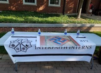 Interfaith Interns table outside of Asbury Hall