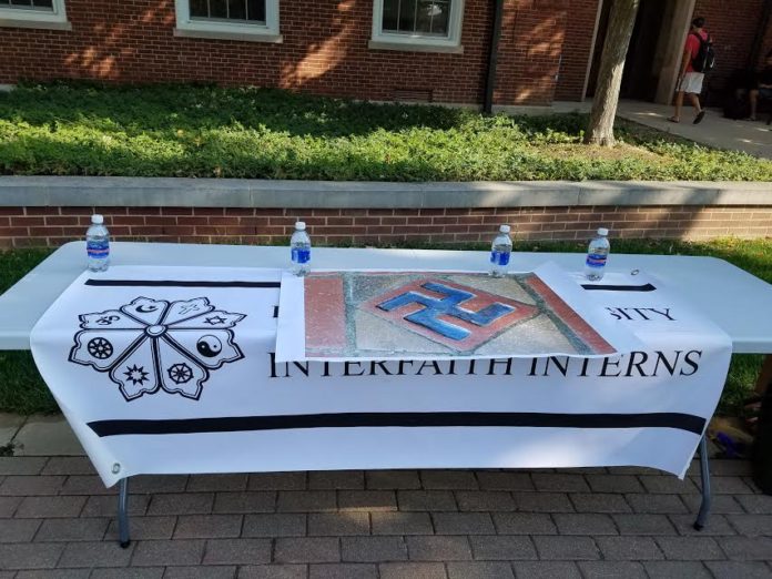 Interfaith Interns table outside of Asbury Hall