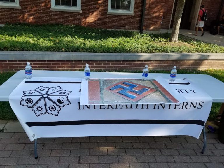 Interfaith Interns table outside of Asbury Hall