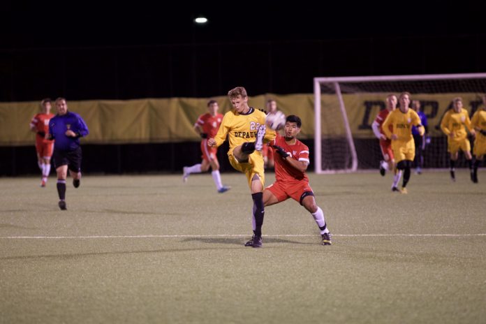 Junior defender TJ Chulick guards a Wabash opponent. REID COOPER