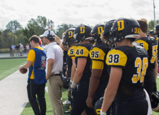 Players watch from the sideline BYRON MASON II