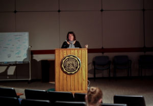 Sara Quinn, the President of the Society for News Design, giving a speech in Watson Forum on photography for journalismNATALIE BRUNINI