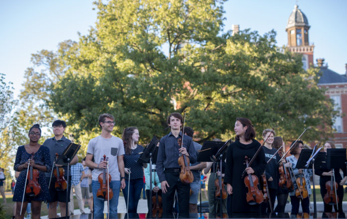 School of Music students stand after their performance with Yo-Yo Ma on Friday in Stewart PlazaNATALIE BRUNINI