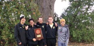 Seniors Nick Meszaros, Polo Burguete, Nathan Reed, Pierce Sheehan, and Josse Smith hold the Conference trophy following the team's win on Saturday. -- Megan Mannering