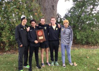 Seniors Nick Meszaros, Polo Burguete, Nathan Reed, Pierce Sheehan, and Josse Smith hold the Conference trophy following the team's win on Saturday. -- Megan Mannering