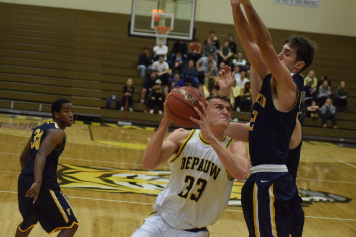 Senior forward Jack VandeMerkt drives up to the basket during the Tigers' 90-72 win over Franklin in the season opener earlier this month. Photo by Madeline Green