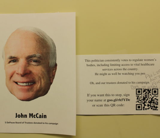 Signs about DePauw Board of Trustees donations to campaigns in the Women's Bathroom in the GCPA _ EMMA MAZUREK THE DEPAUW