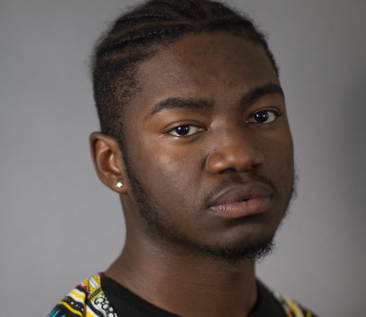 Sophomore Chris Neal models in an elaborate dashikiBYRON MASON II