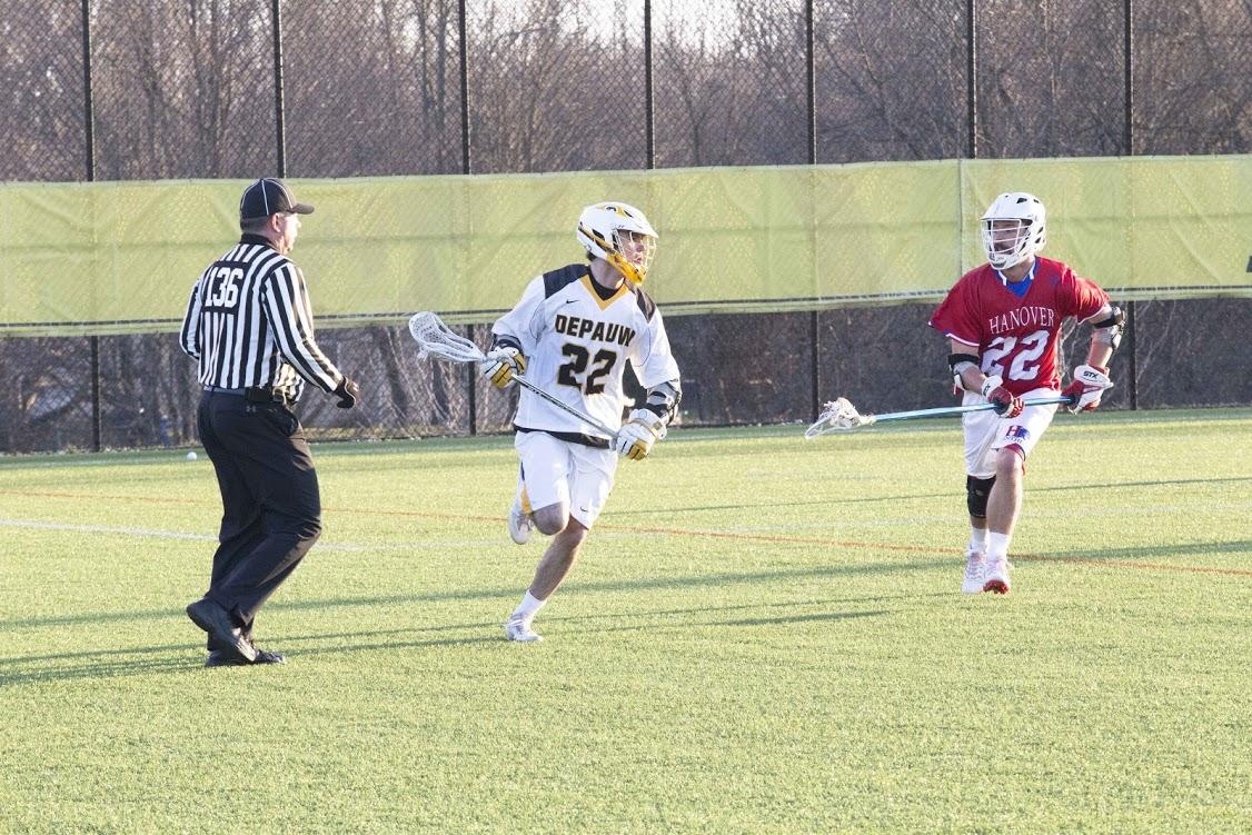 Senior Adam Bridges looks for a pass with pressure from Hanover defense. The tigers defeated Hanover with a score of 4-2. EMMANUEL KWAKYE / THE DEPAUW
