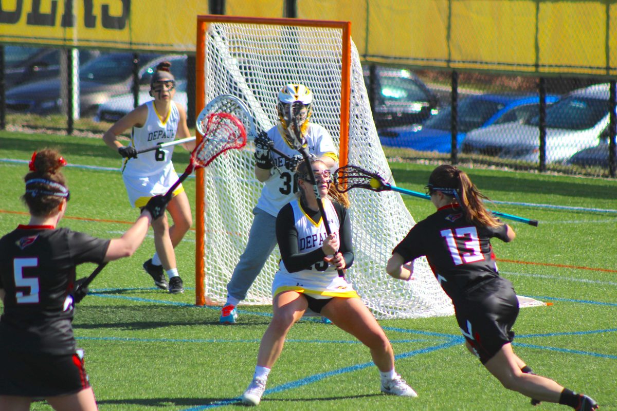 Fr. D Maeve Sheehan takes a stand in front of the goal JENNALYN MCNEAL