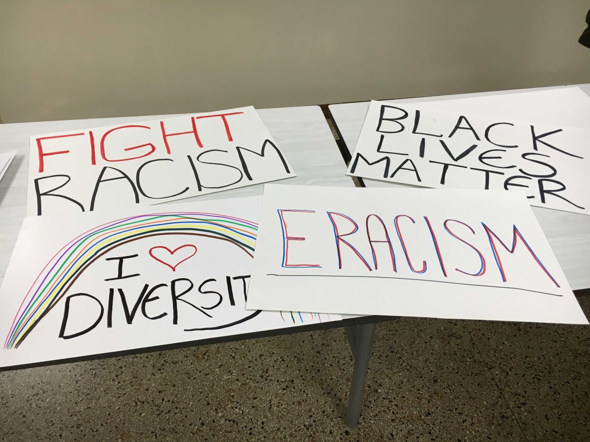 Greencastle residents young and old met in the basement of Gobin Church to make signs to carry during their walk_ ALAINA STELLWAGEN