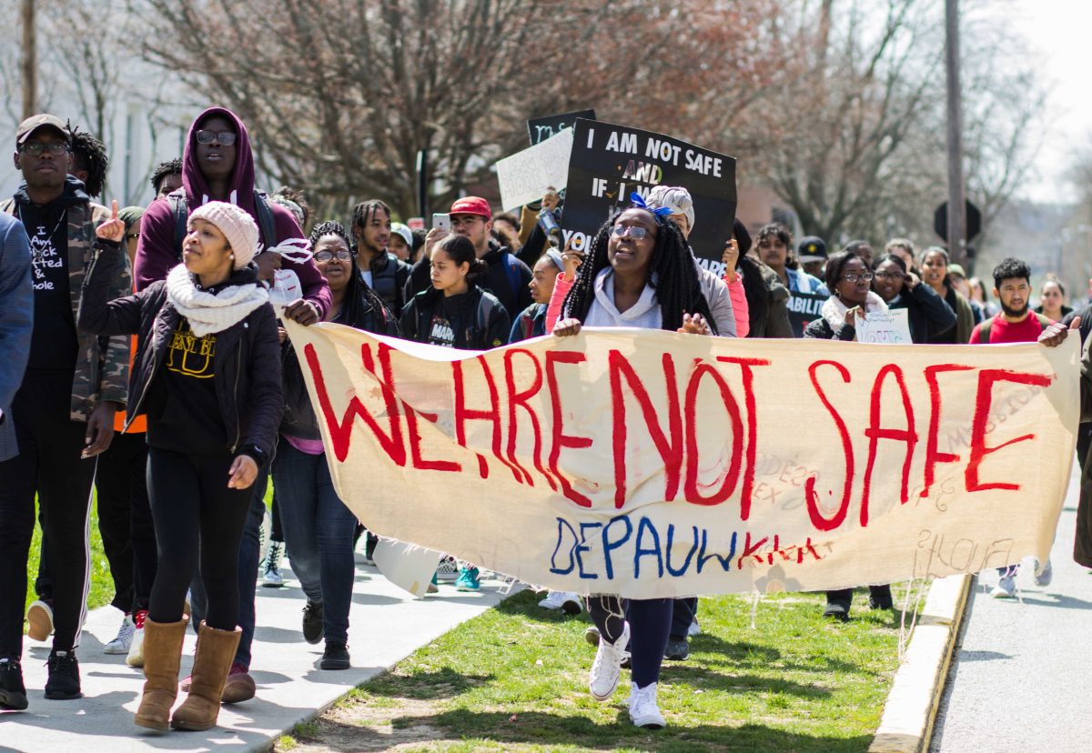 Student activists march down Locust Street in protest of the racist occurrences on campus. BYRON MASON II