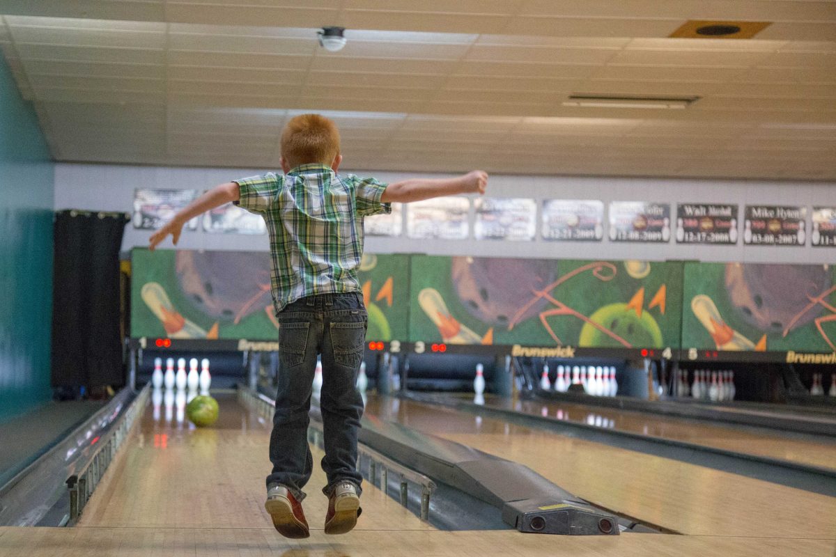 Colt, 4, jumps with joy at the hope of getting a spare at 3G Bowling Alley in Greencastle. (Tilly Marlatt/ The DePauw)