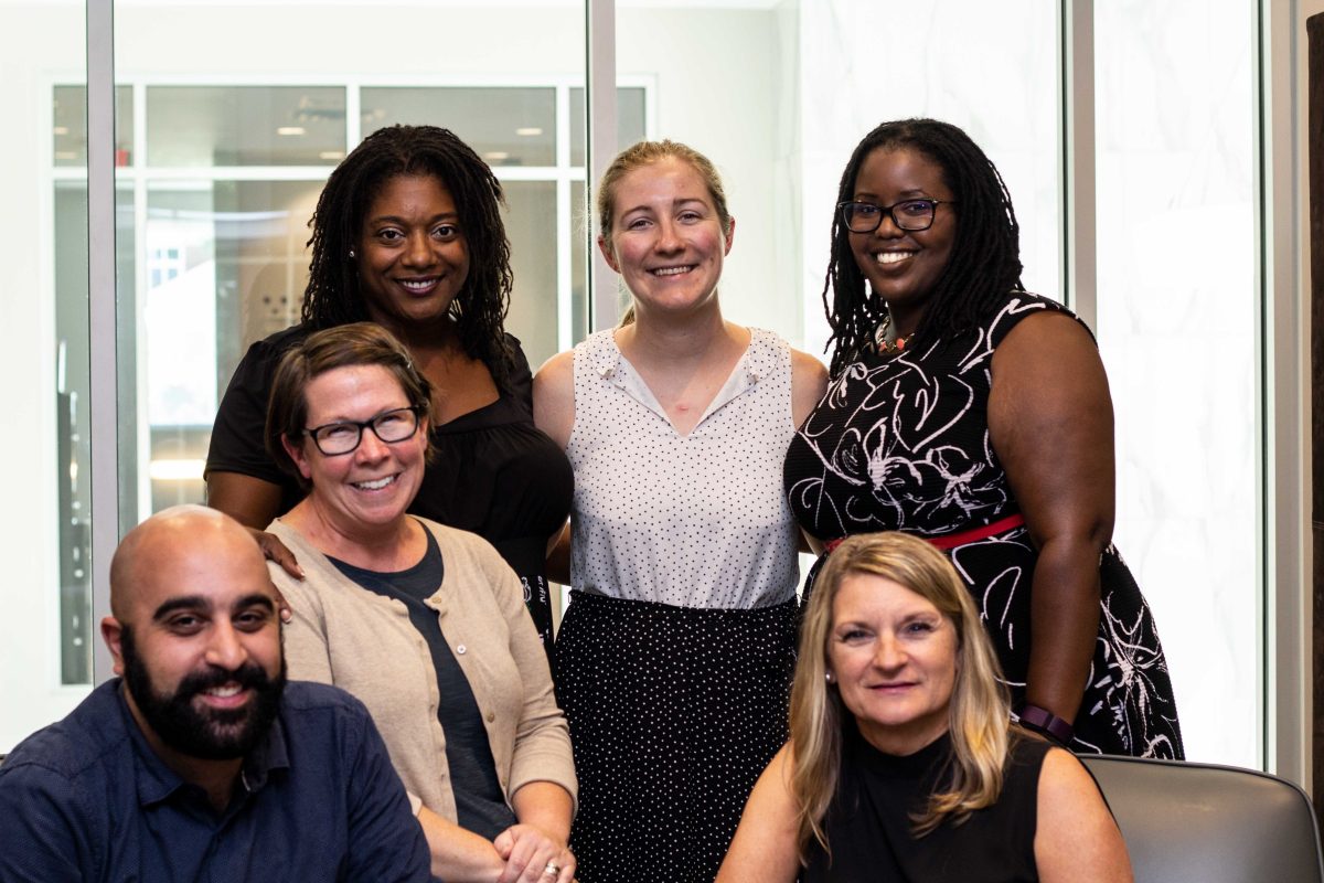 The CDI staff poses with the new interim direction Karen Wimbley BYRON MASON II