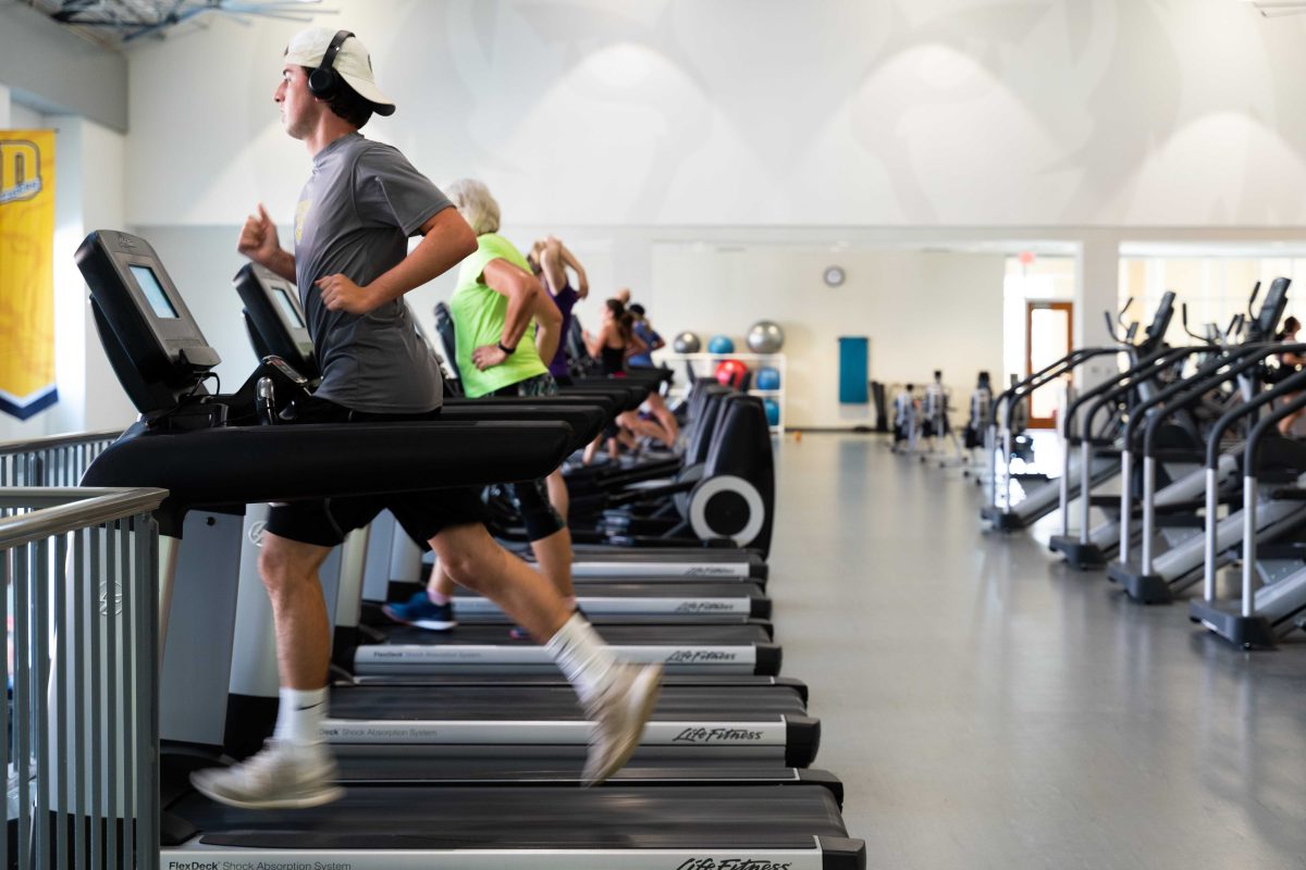 Students, faculty, and Greencastle locals work on their cardio at the Lily Fitness Center. KEISUKE OHTANI