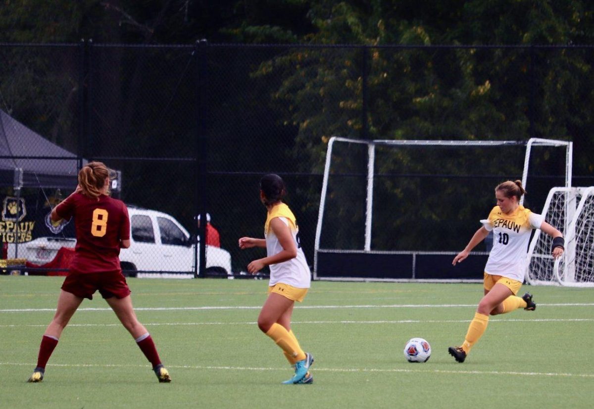 Junior Mary Goodale kicks the ball down the field. Goodale assisted Alex Wendt in scoring an early goal for the Tigers. (Photo by Nicolas Forwood)
