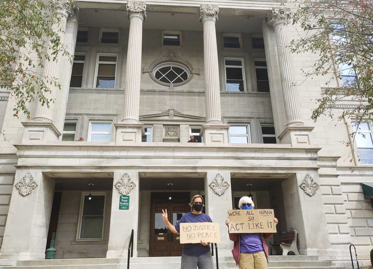 Protesters stand in front of the Putnam County court house 
Photo by Ian S. Brundige