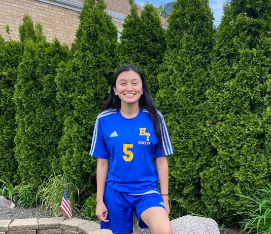 Atzihri Guido stand in her soccer uniform