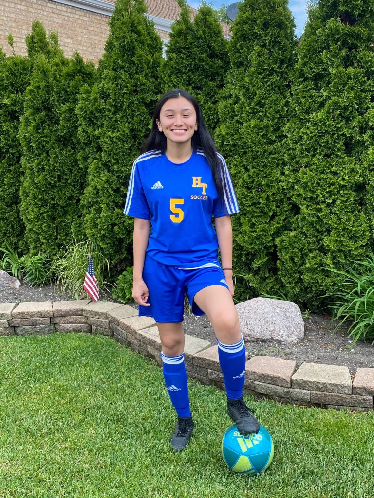 Atzihri Guido stand in her soccer uniform