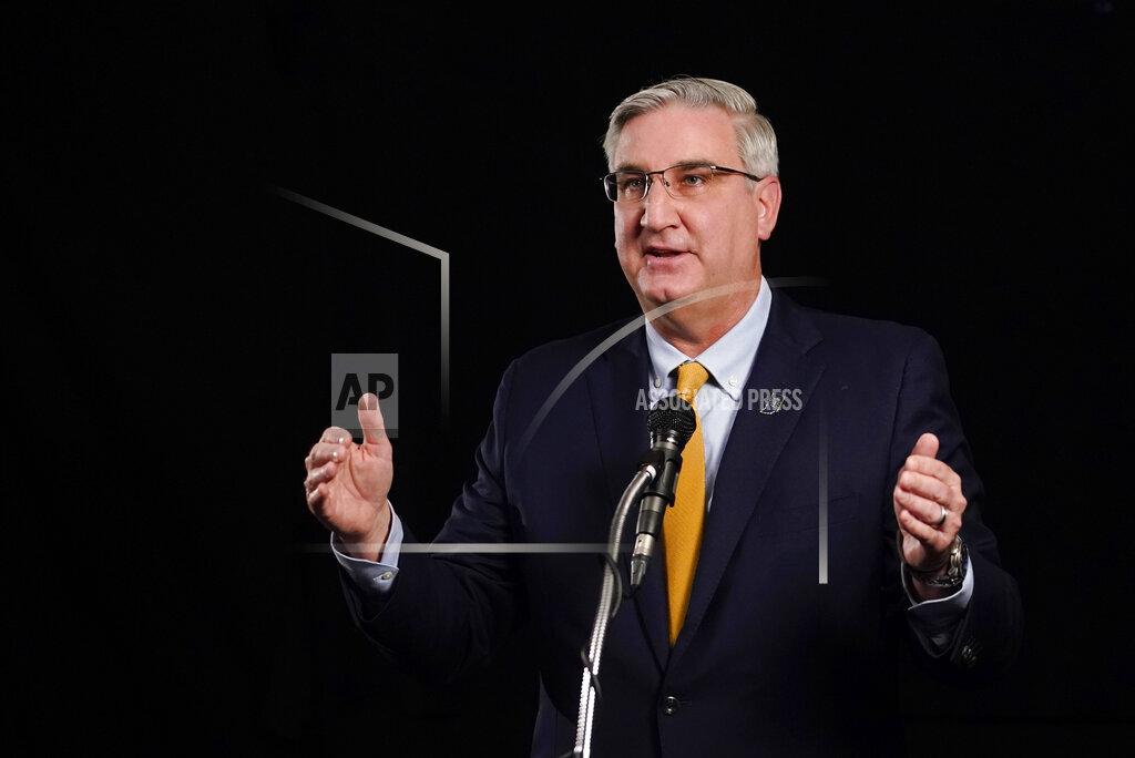 Indiana Republican Gov. Eric Holcomb participates in the Indiana Gubernatorial debate with Democrat Woody Myers and Libertarian Donald Rainwater, Tuesday, Oct. 27, 2020, in Indianapolis. The candidates were in separate studios to allow for social distancing guidelines. (AP Photo/Darron Cummings)