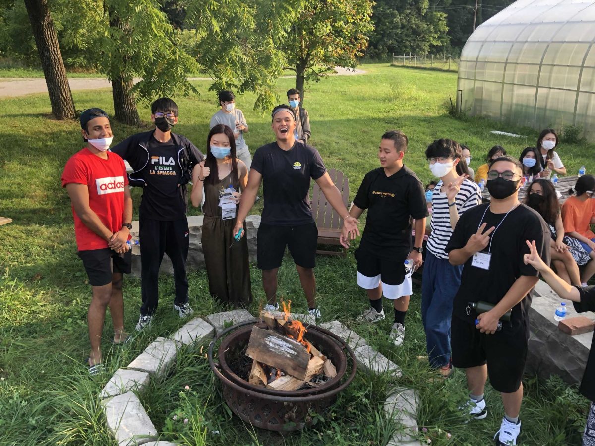 First-Year and Sophomore international students enjoy the bonfire and S'mores at the Campus farm on their second or third on campus. Photo by Gina Chuang.