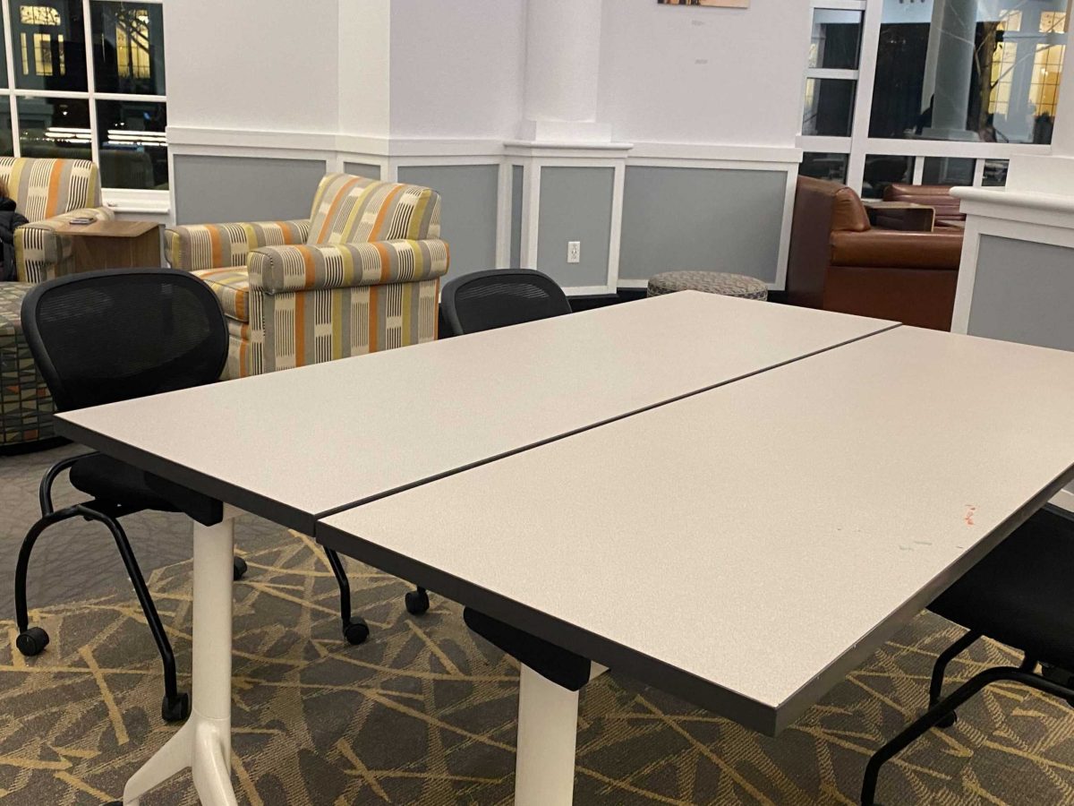 An empty study table in UB living room. Photo by Ngan Tran 25'