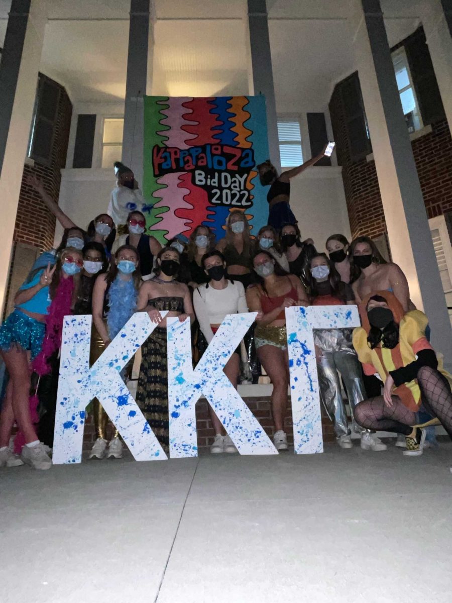The senior class of Kappa Kappa Gamma pose with masks during their in-person bid night on Jan. 30, per COVID-19 guidelines.