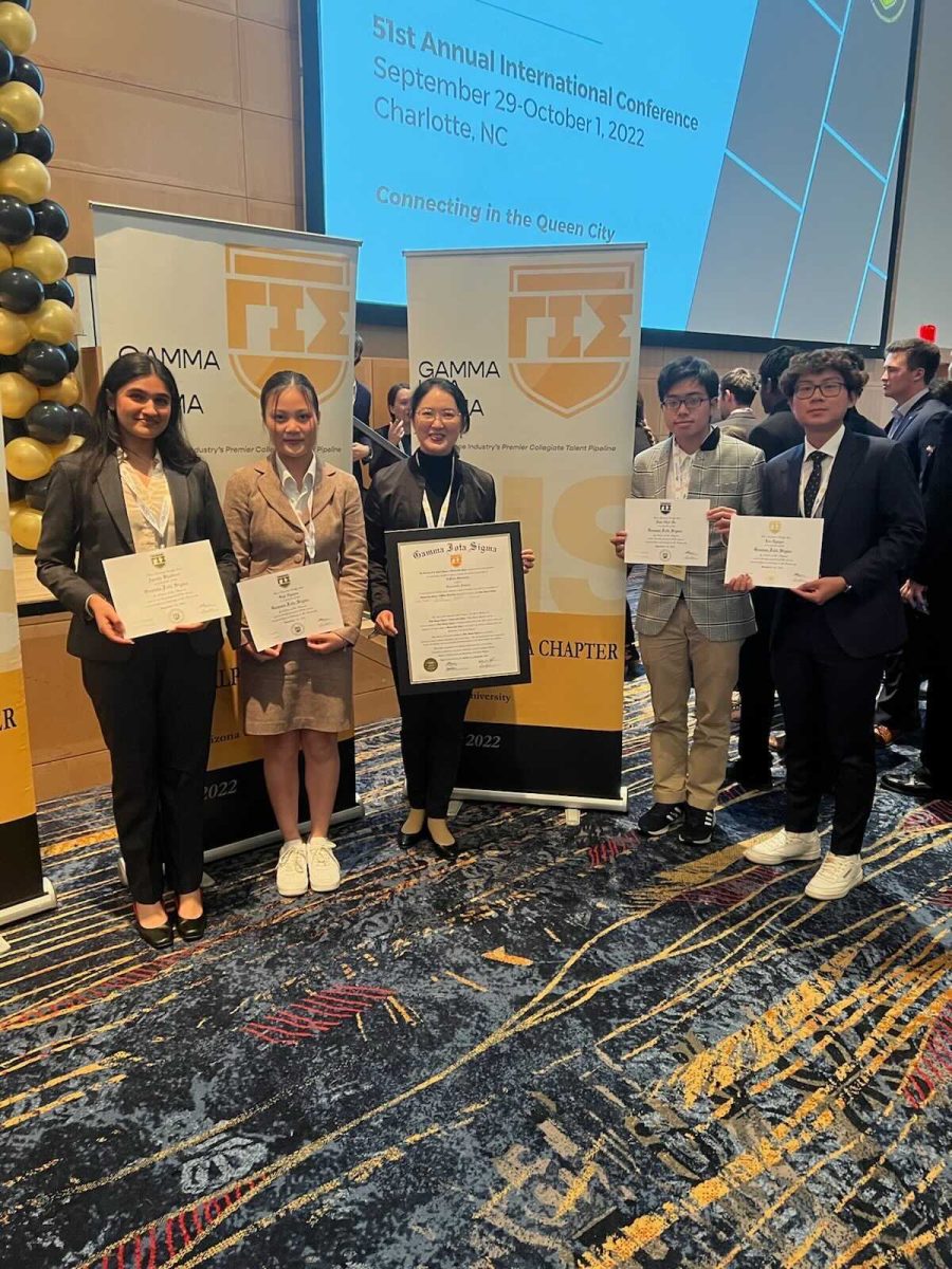 DePauw representatives being awarded the chapter and founding members certificates (Left to right: Ayusha Bhattarai, Gigi Nguyen, Professor Zhixin Wu, Nhat Nam Ho, Larry Nguyen).
