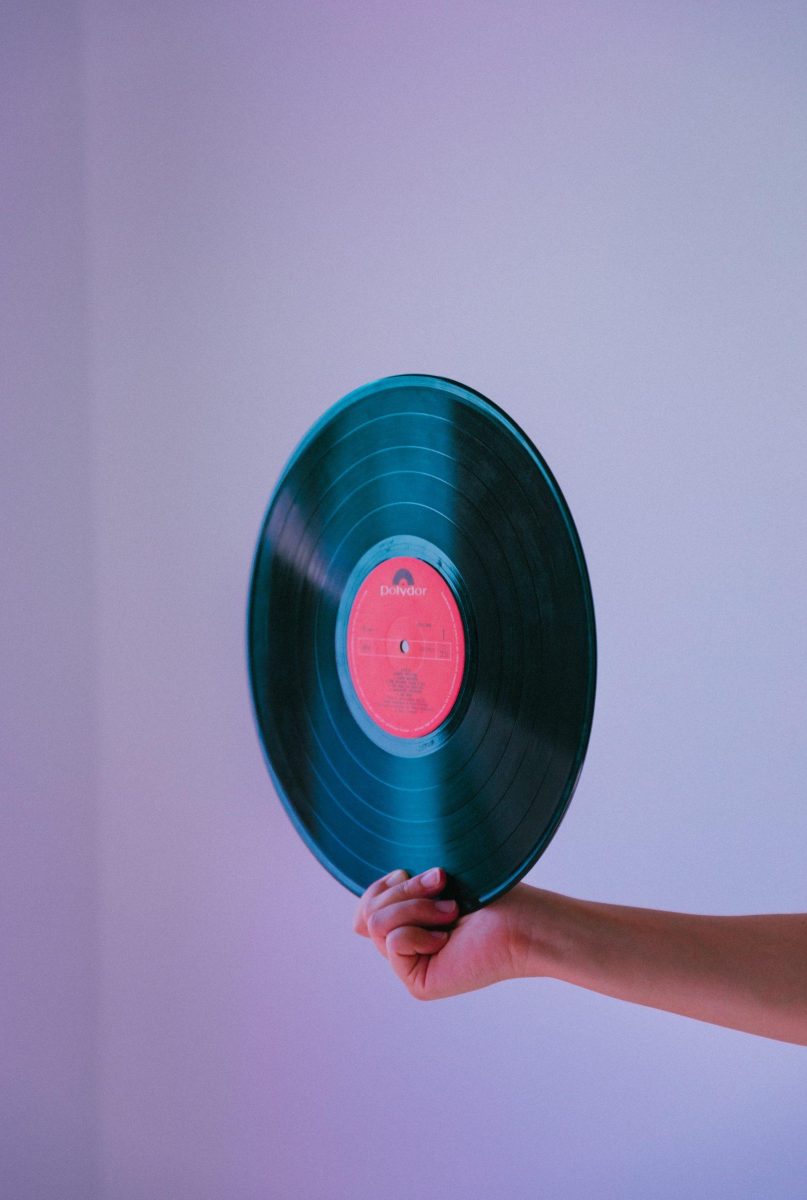 Hand holding vinyl record. Photo courtesy of Kobu Agency.